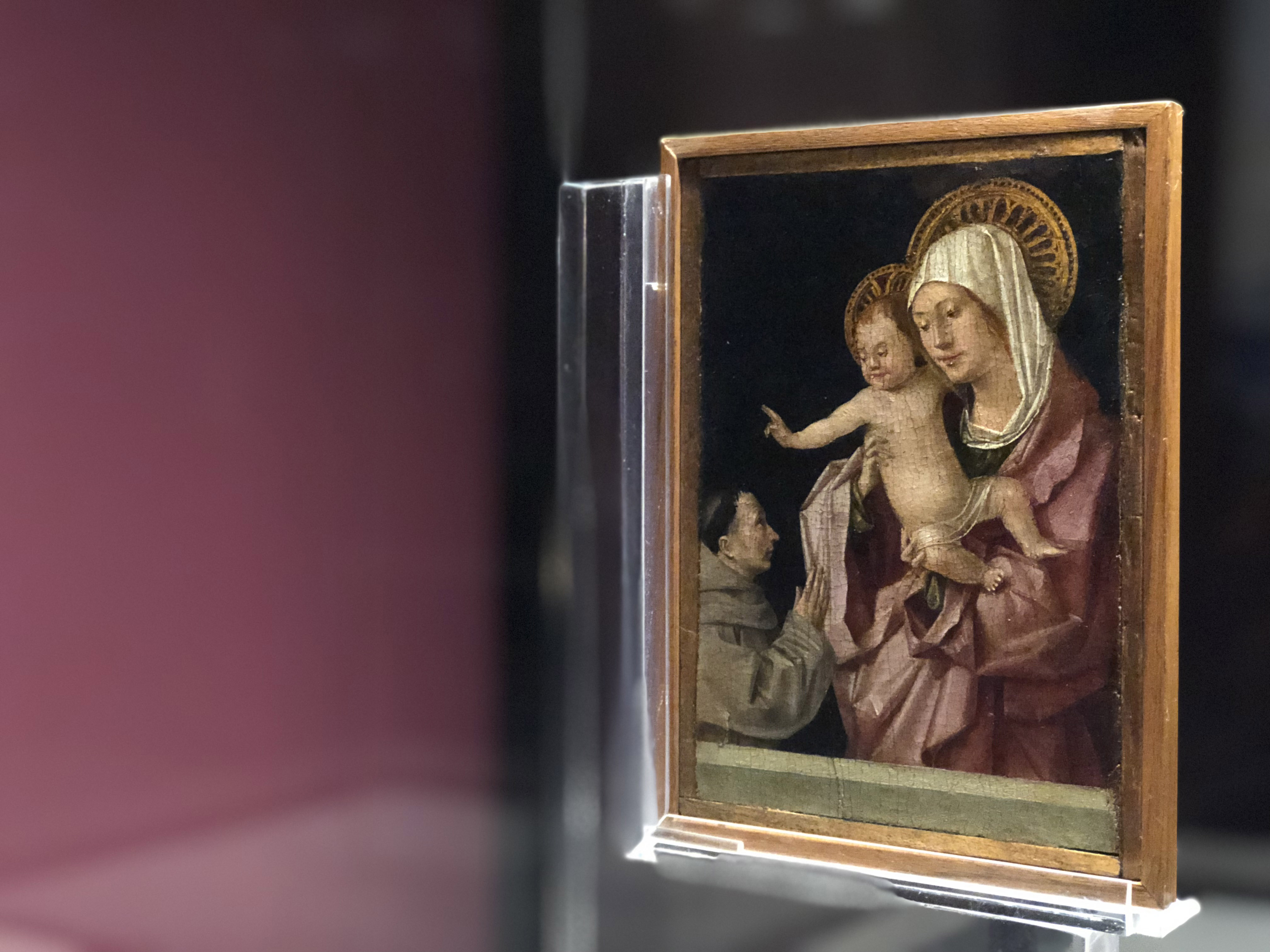 la Madonna con il Bambino benedicente e francescano in adorazione